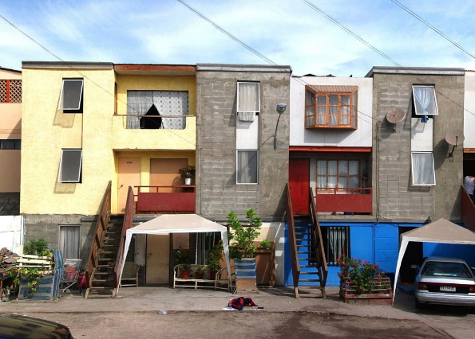 Figure 2. Architecture examples.
                        A) Monterrey (Santa Catalina), Project of Elemental Architects, by A. Aravena, G. Arteaga, H. García Huidobro, 2010.
                        B) The basic Core planned design by the architects. Self built additions by residents during the habitation process. Project of Elemental Architects, by A. Aravena, G. Arteaga, H. García Huidobro, 2010. Photography by Ramírez.